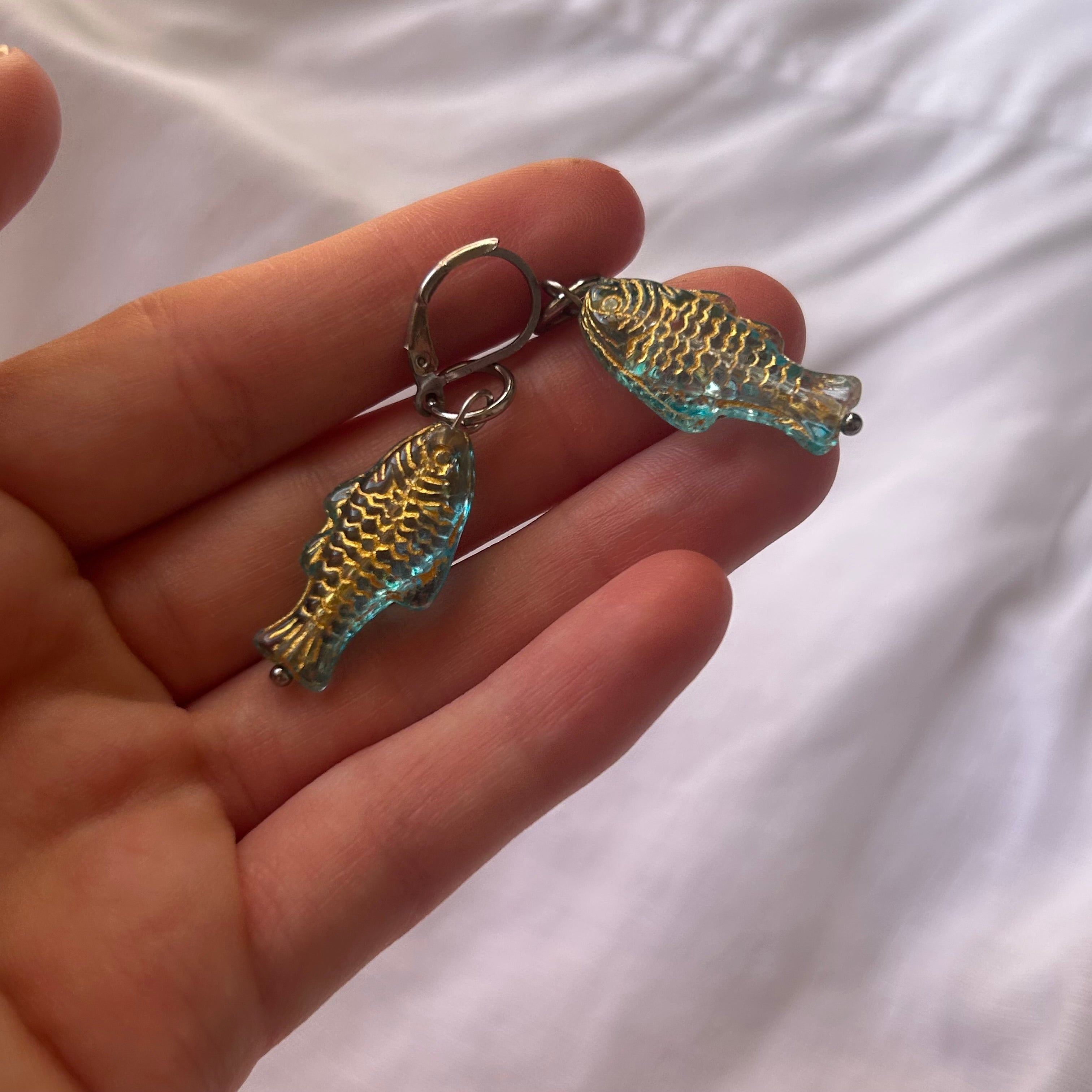 Gold on jelly blue fish earrings