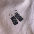 Thriller reader cinema ticket charm earrings