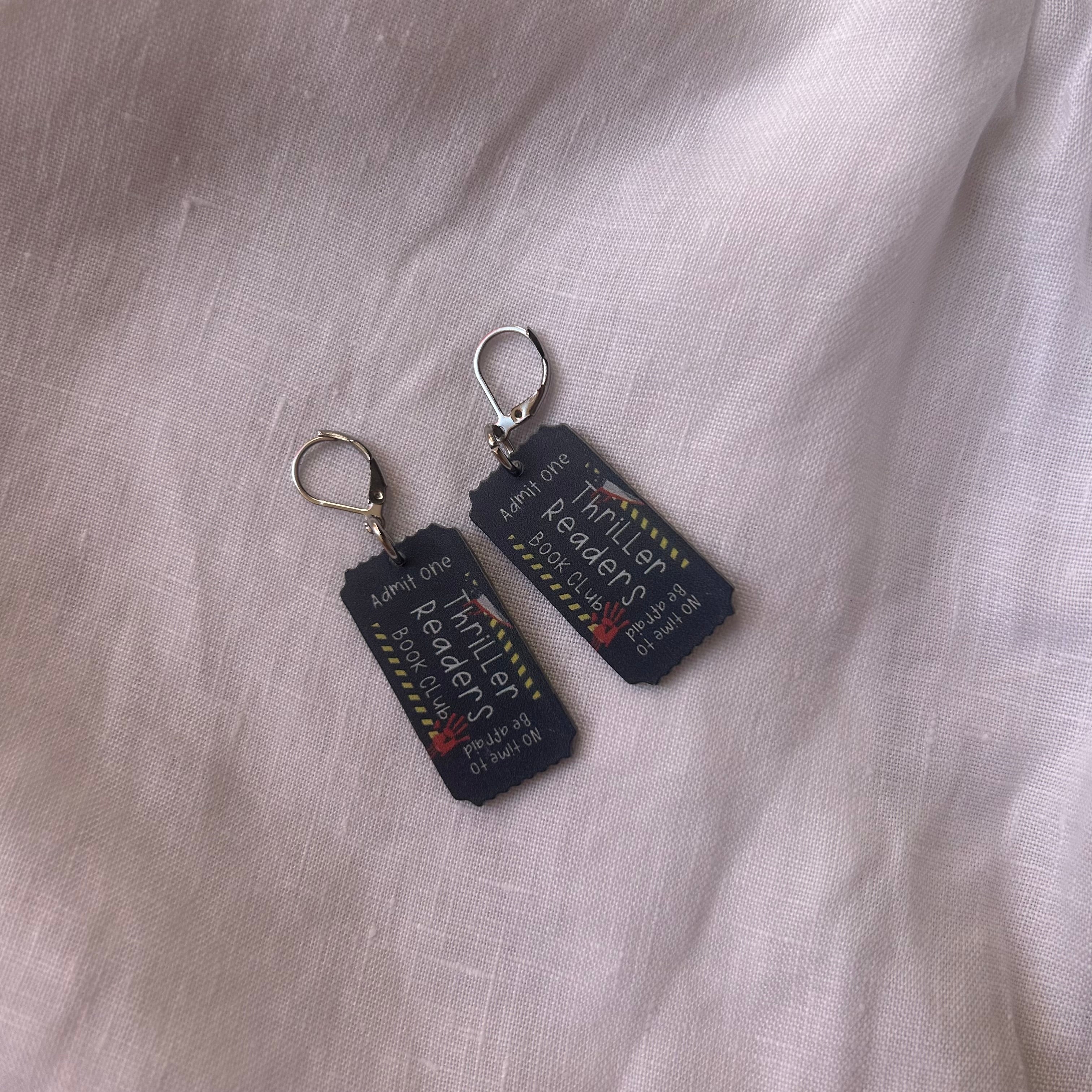 Thriller reader cinema ticket charm earrings