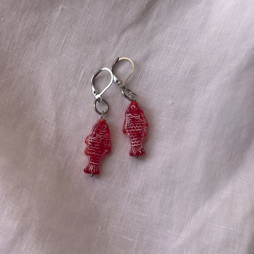 White on red fish earrings