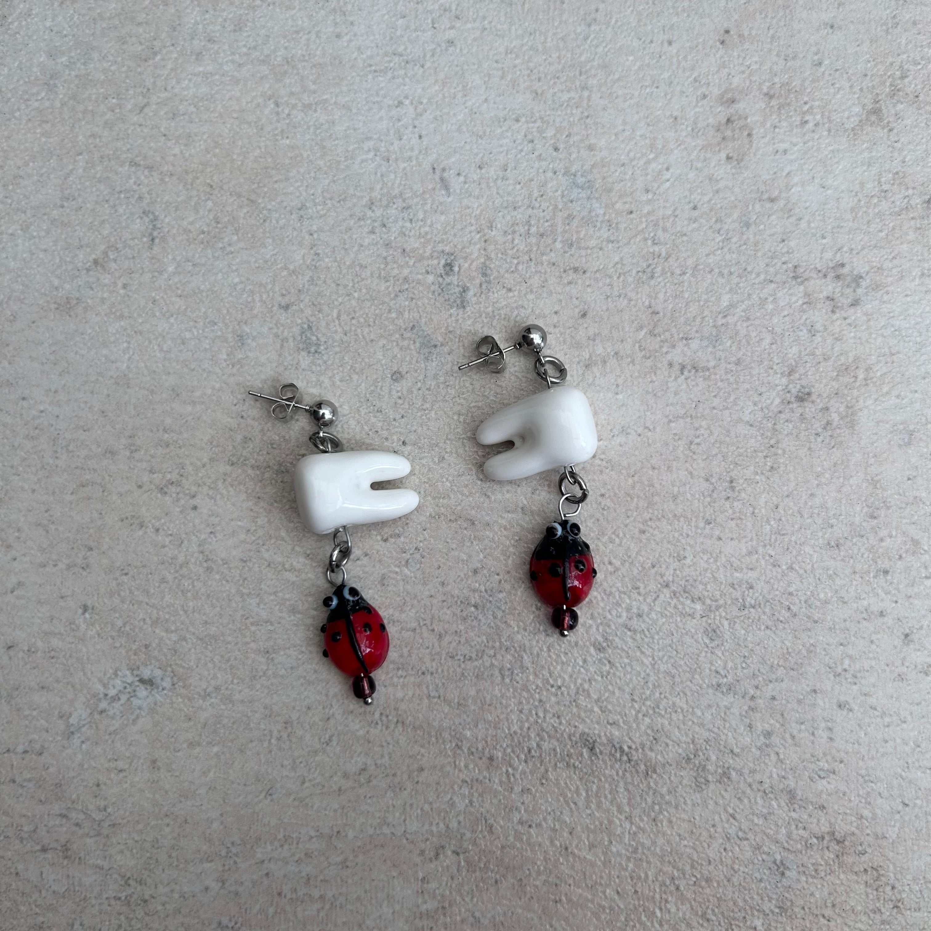 Tooth bug earrings