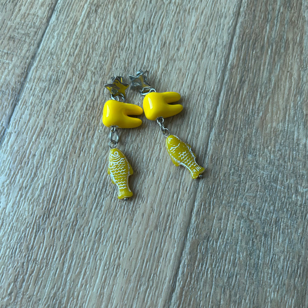 Ceramic tooth yellow fish earrings