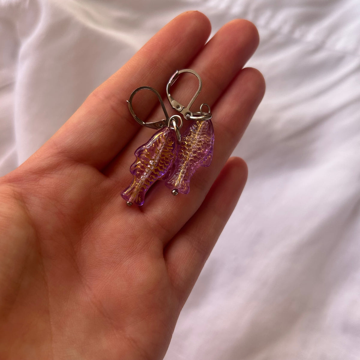 Gold on purple fish earrings