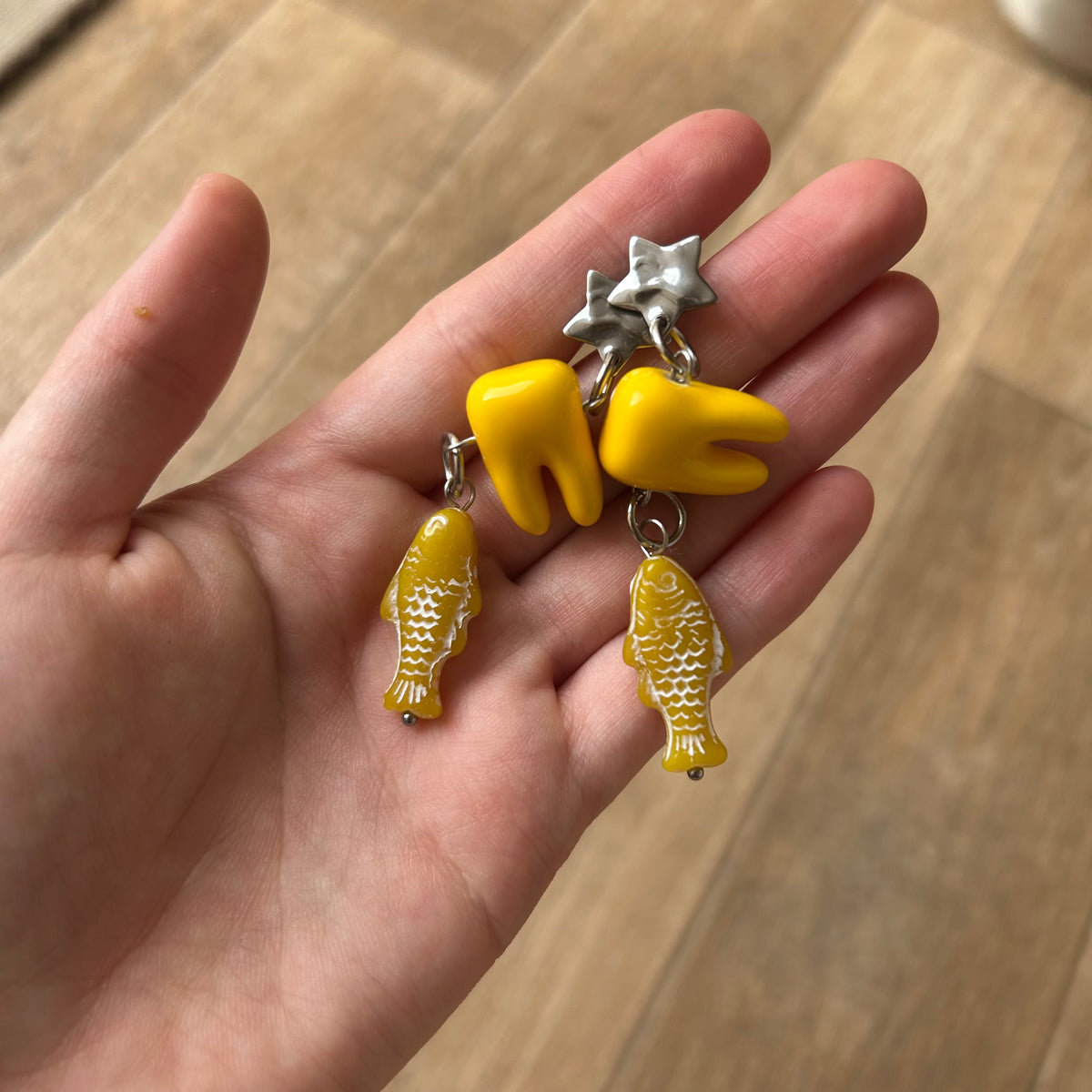Ceramic tooth yellow fish earrings