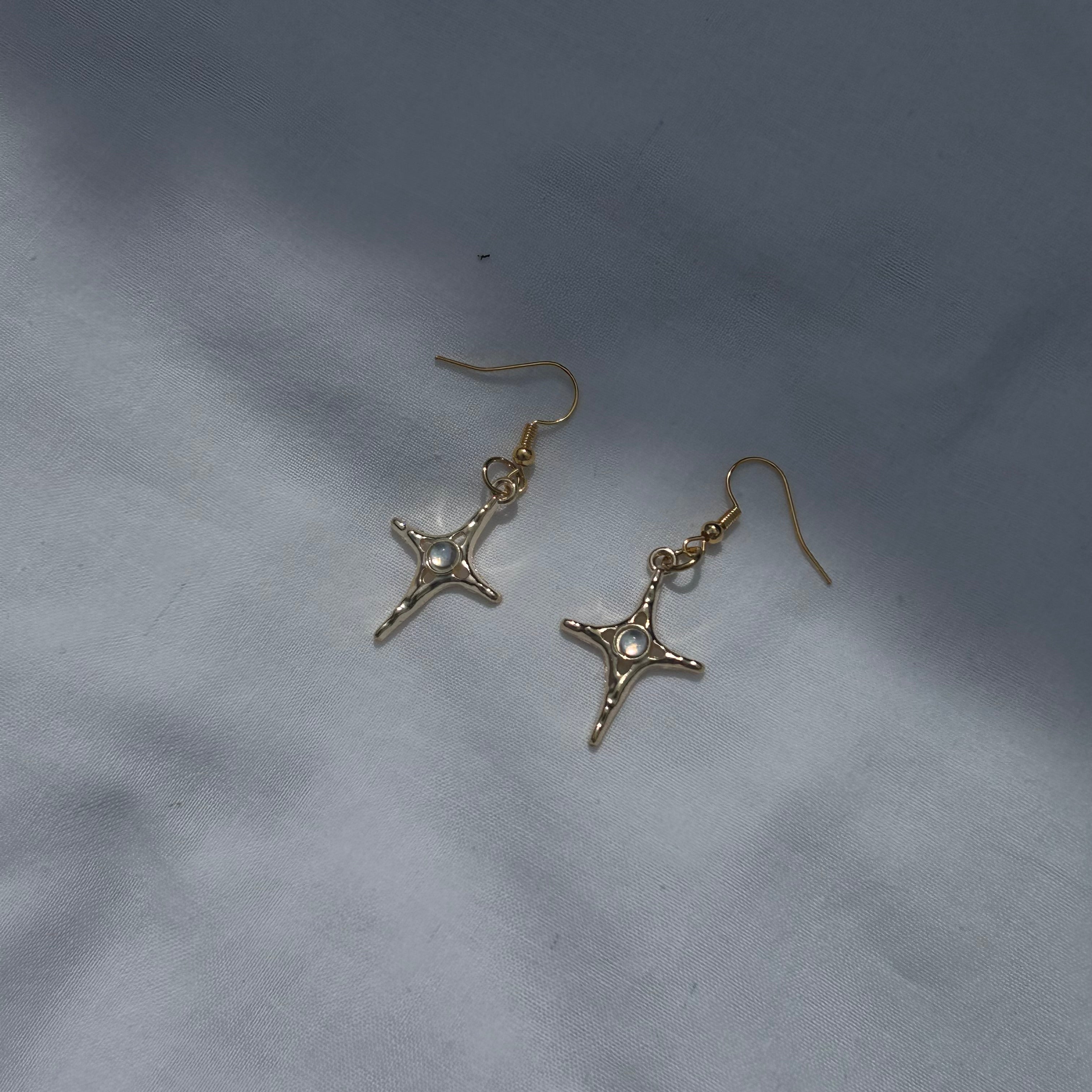 Constellation star in gold earrings