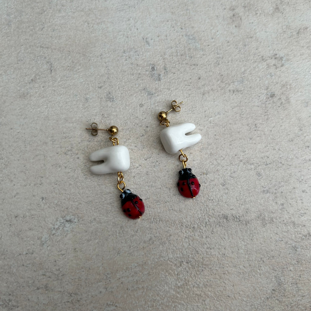 Tooth bug earrings