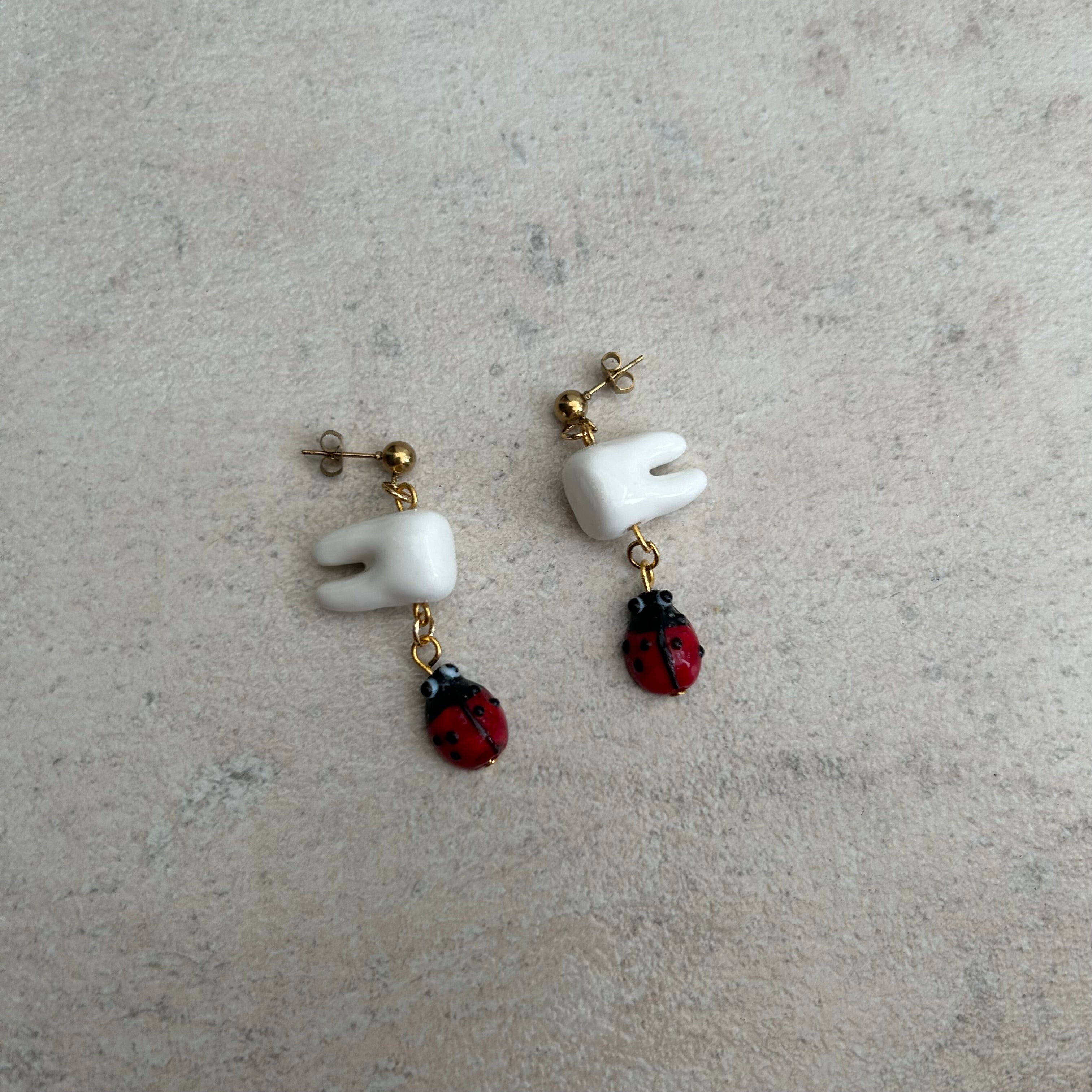 Tooth bug earrings
