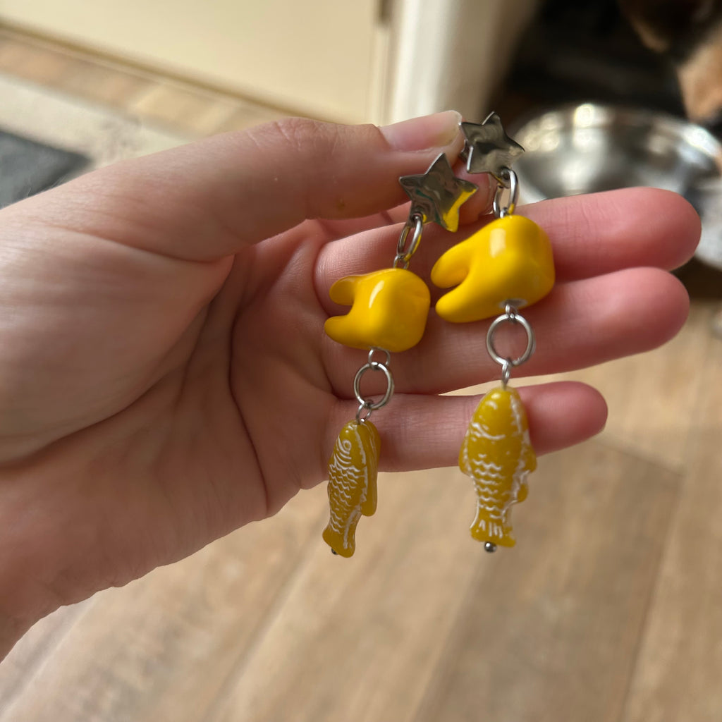 Ceramic tooth yellow fish earrings