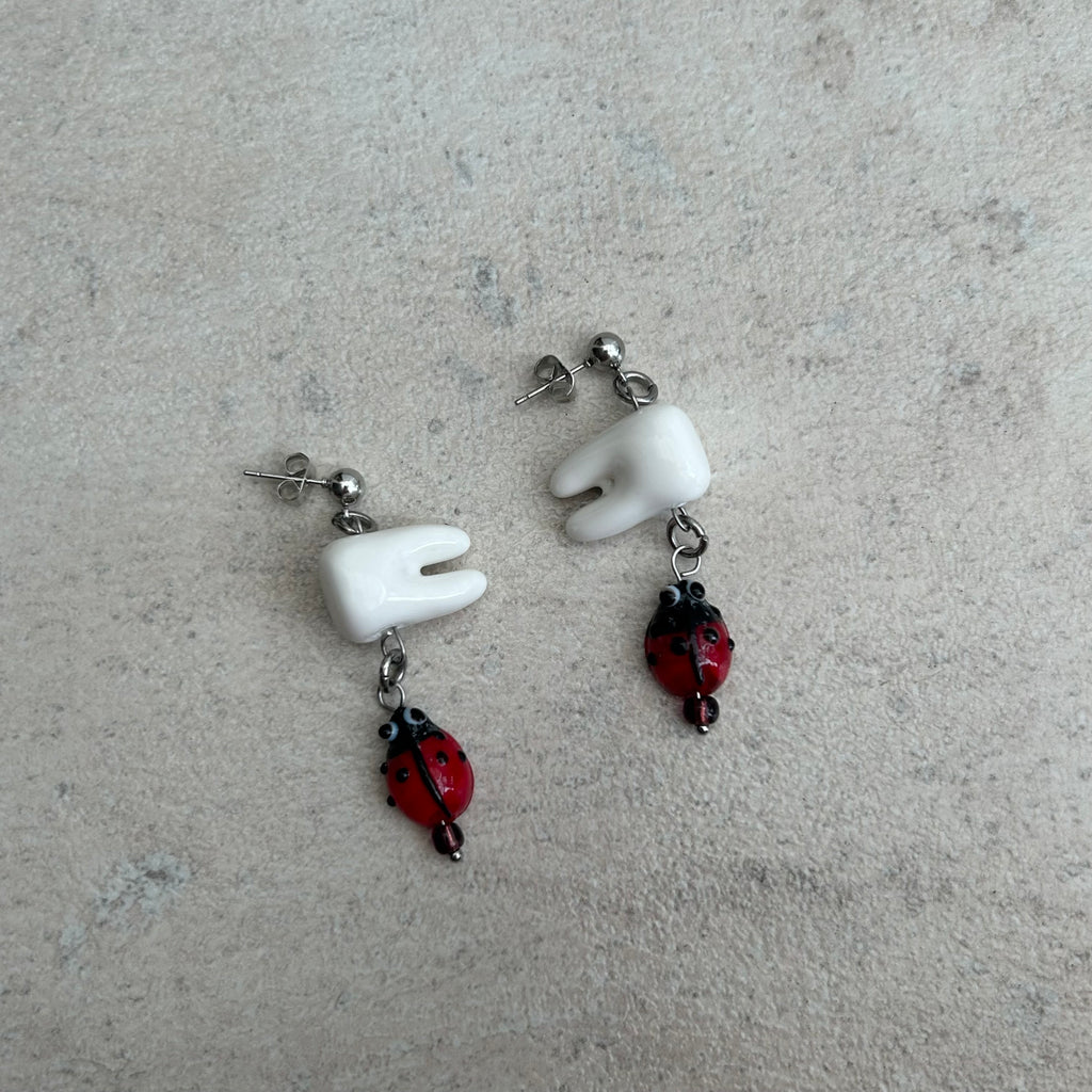 Tooth bug earrings