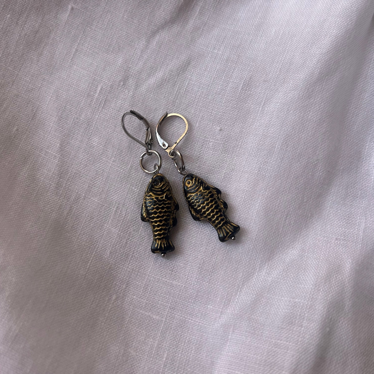 Gold on black fish earrings