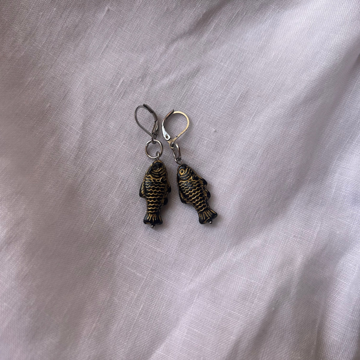 Gold on black fish earrings