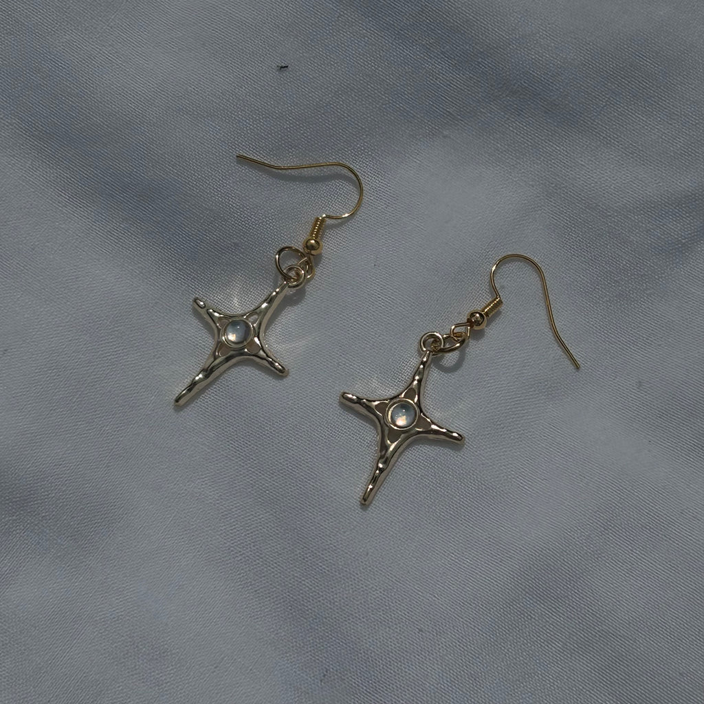 Constellation star in gold earrings