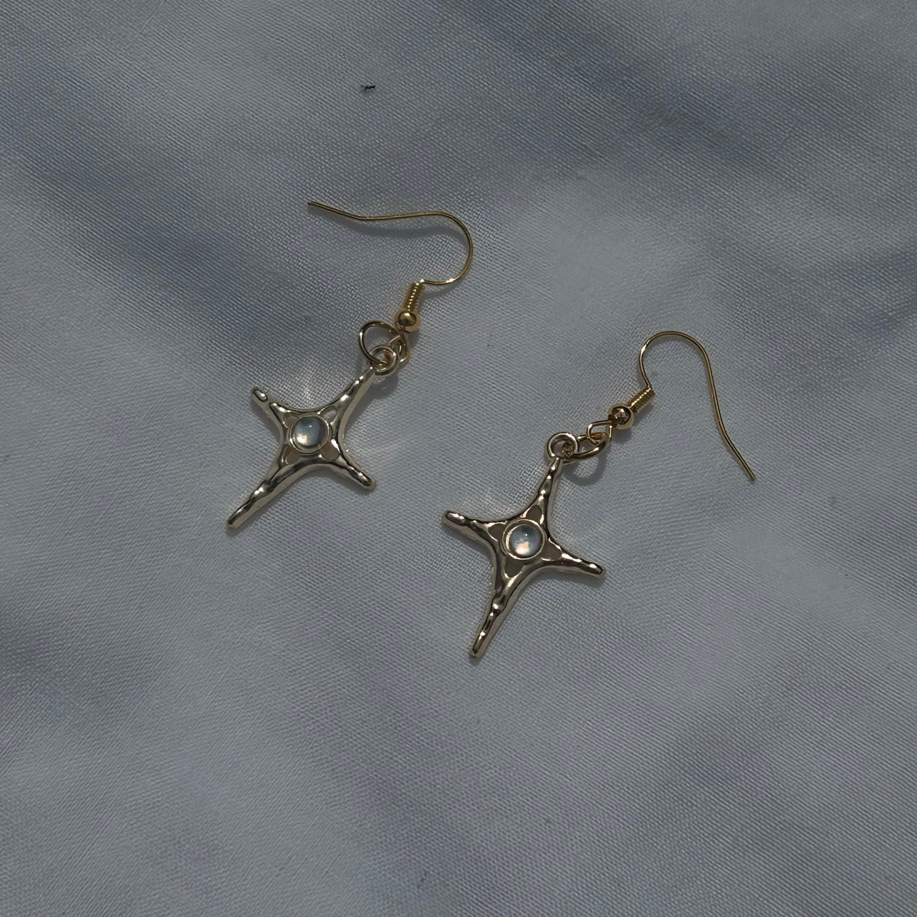 Constellation star in gold earrings