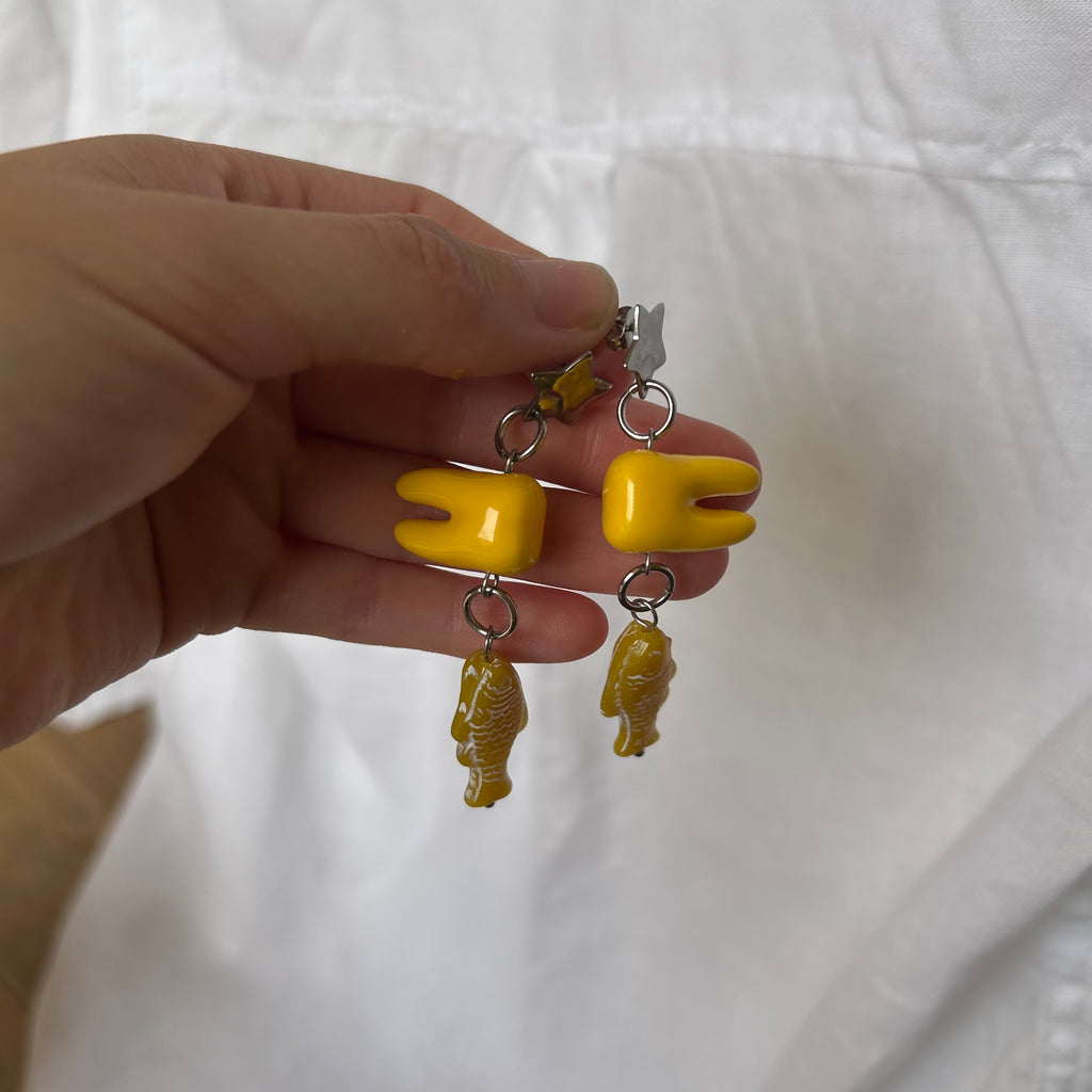 Ceramic tooth yellow fish earrings