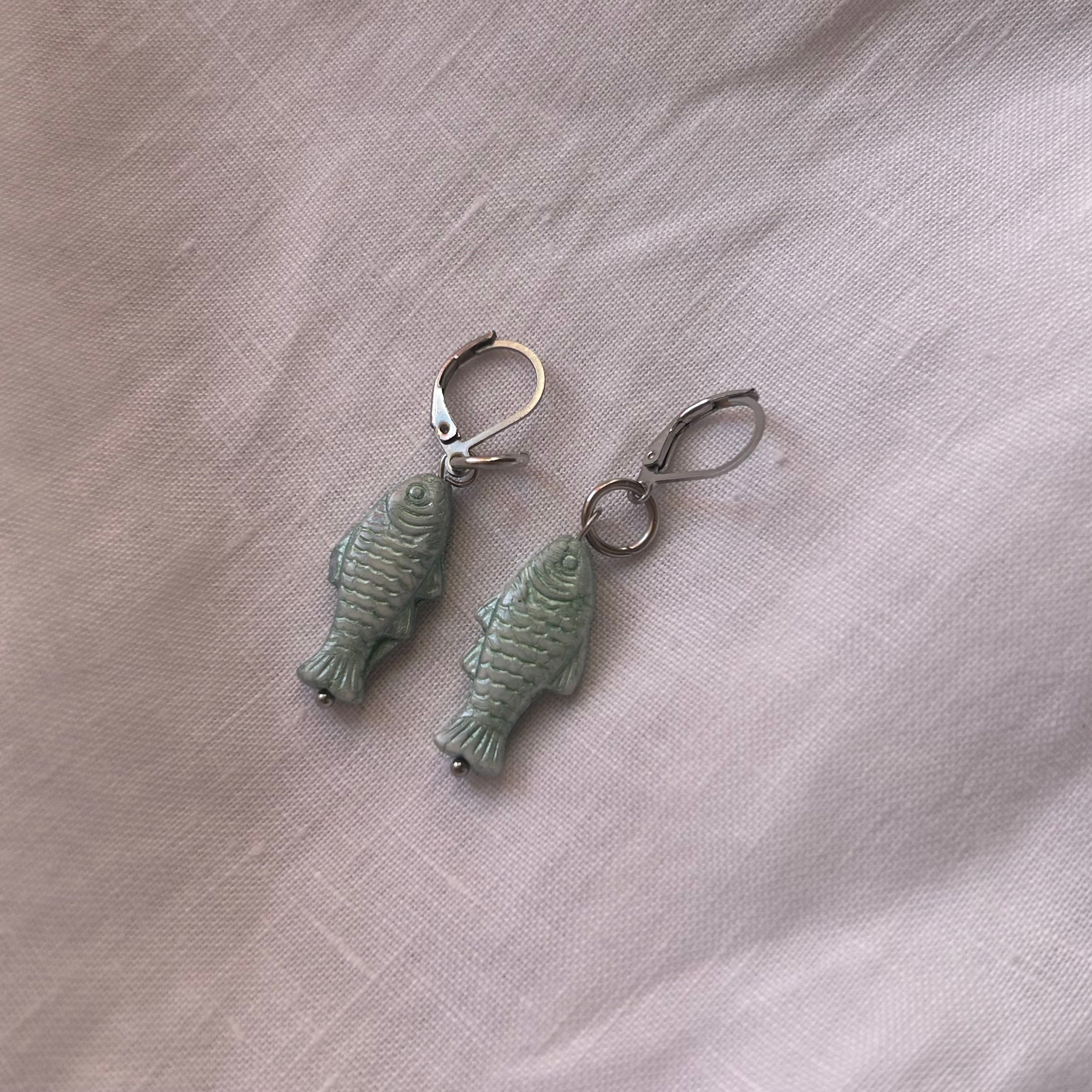 Teal glass fish earrings