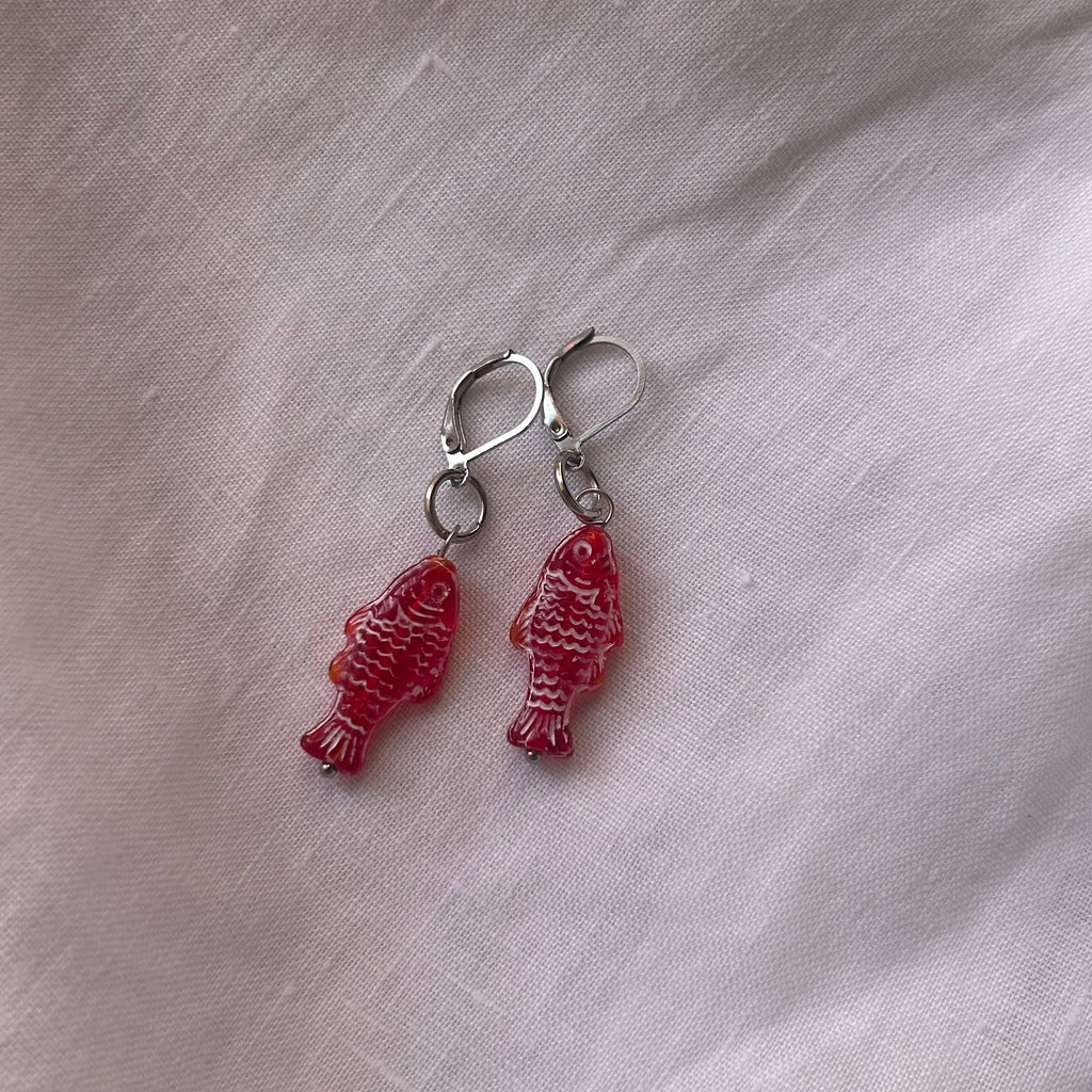 White on red fish earrings