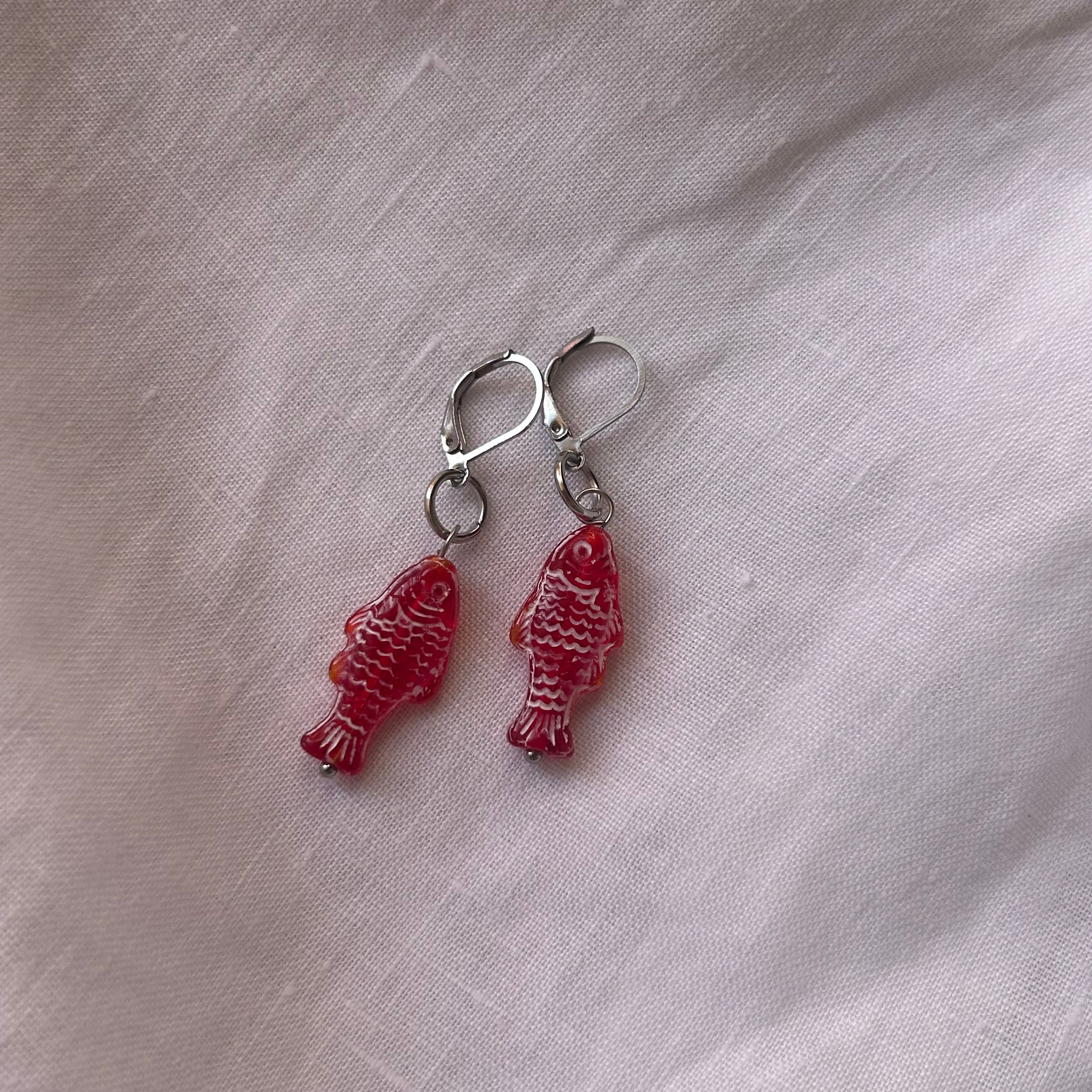 White on red fish earrings
