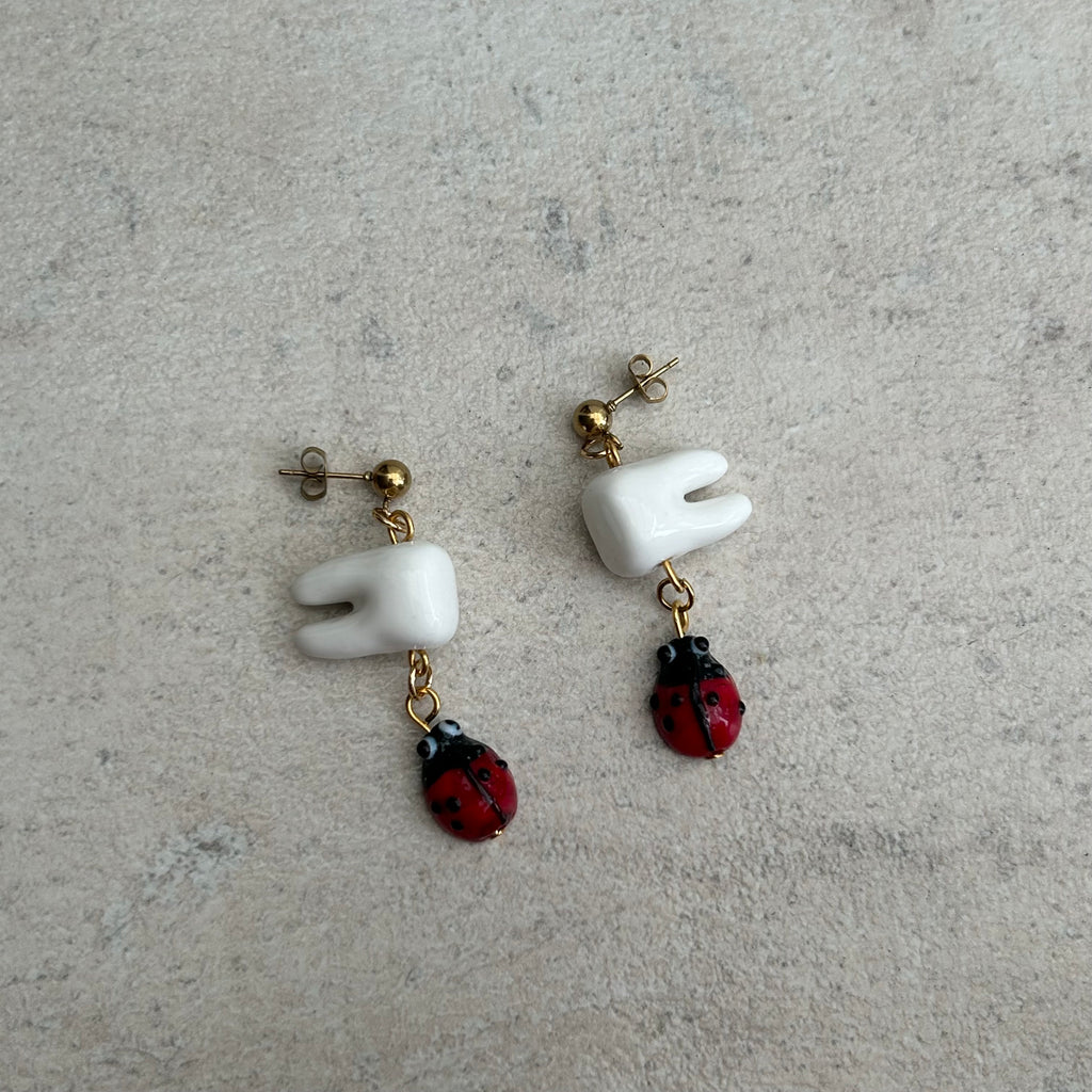 Tooth bug earrings