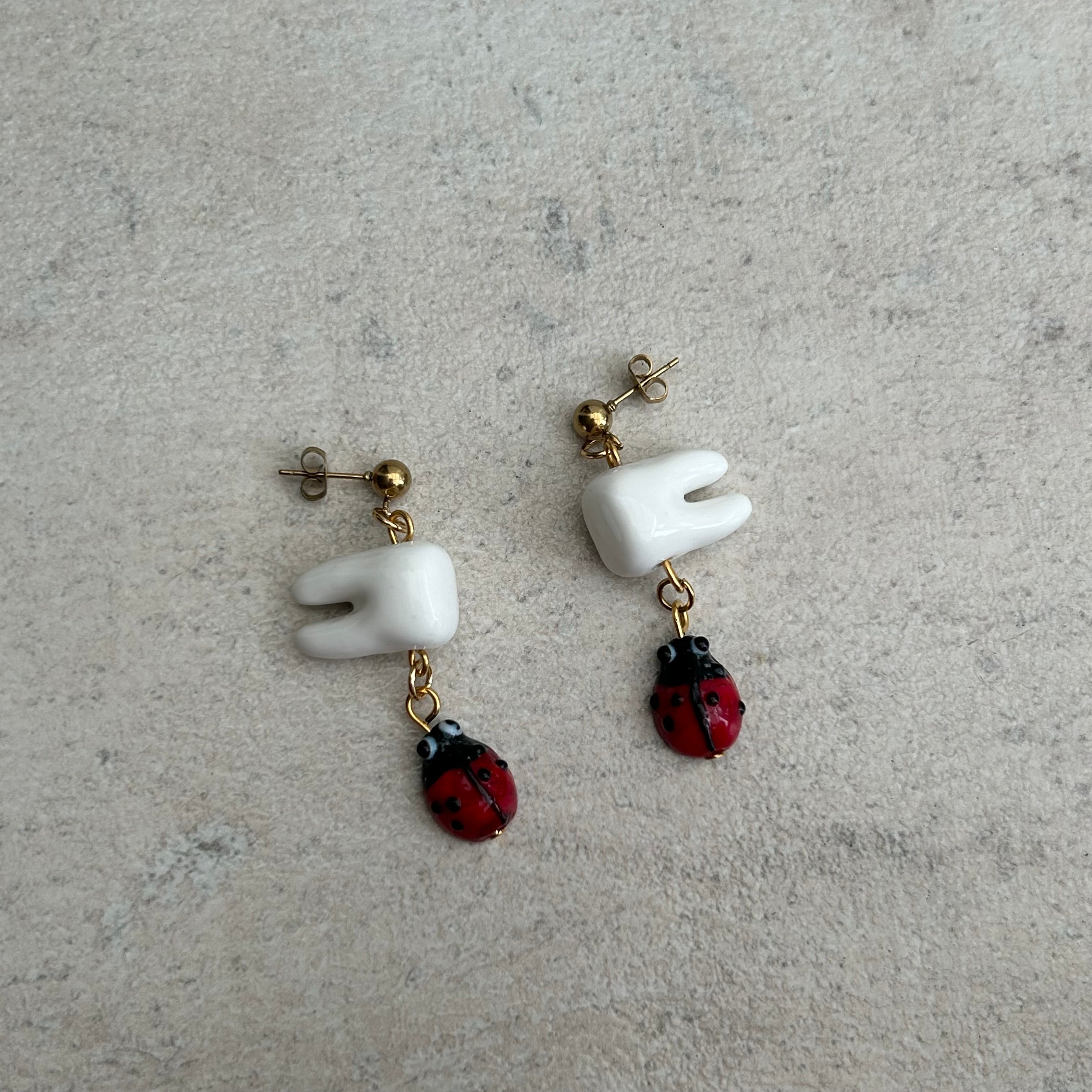 Tooth bug earrings