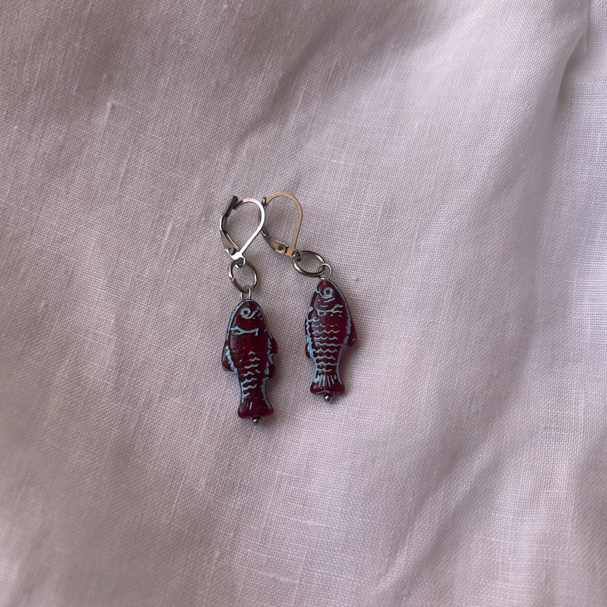 Blue on burgundy fish earrings