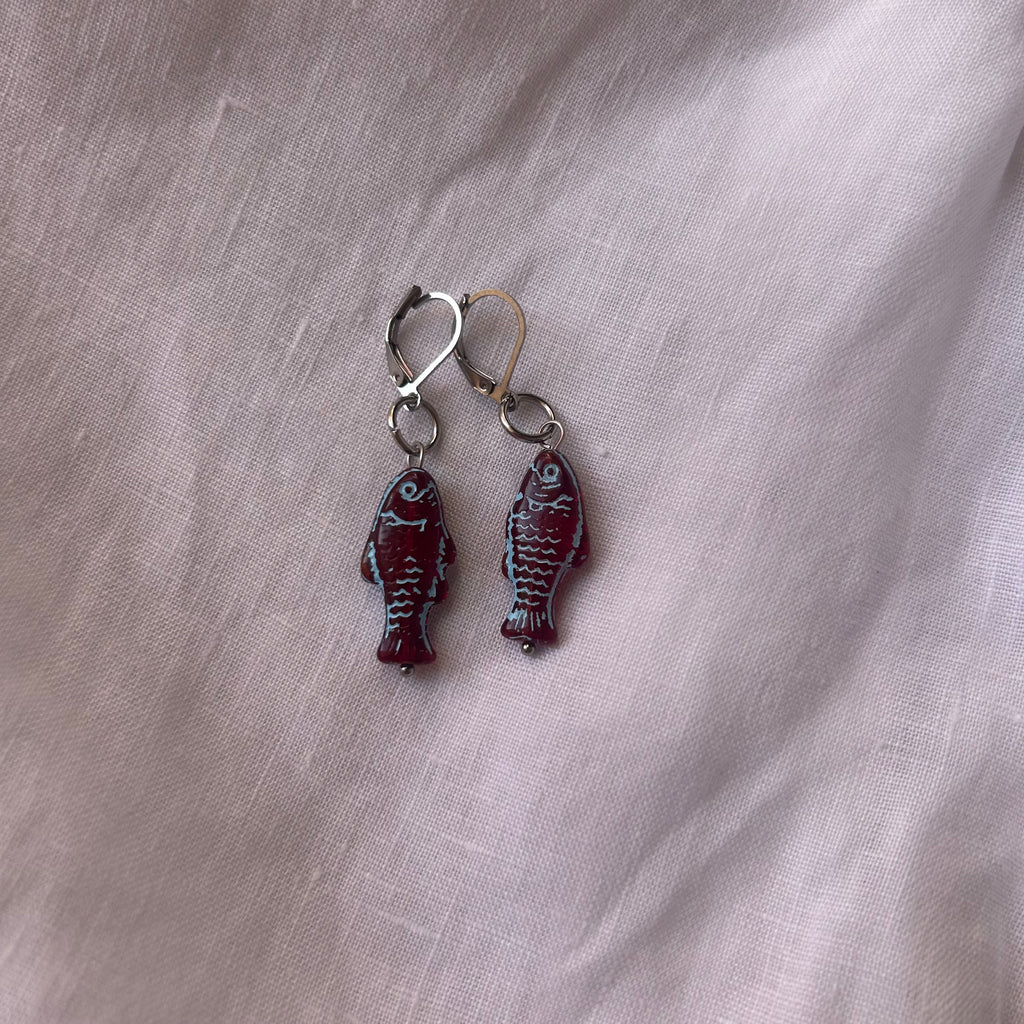 Blue on burgundy fish earrings