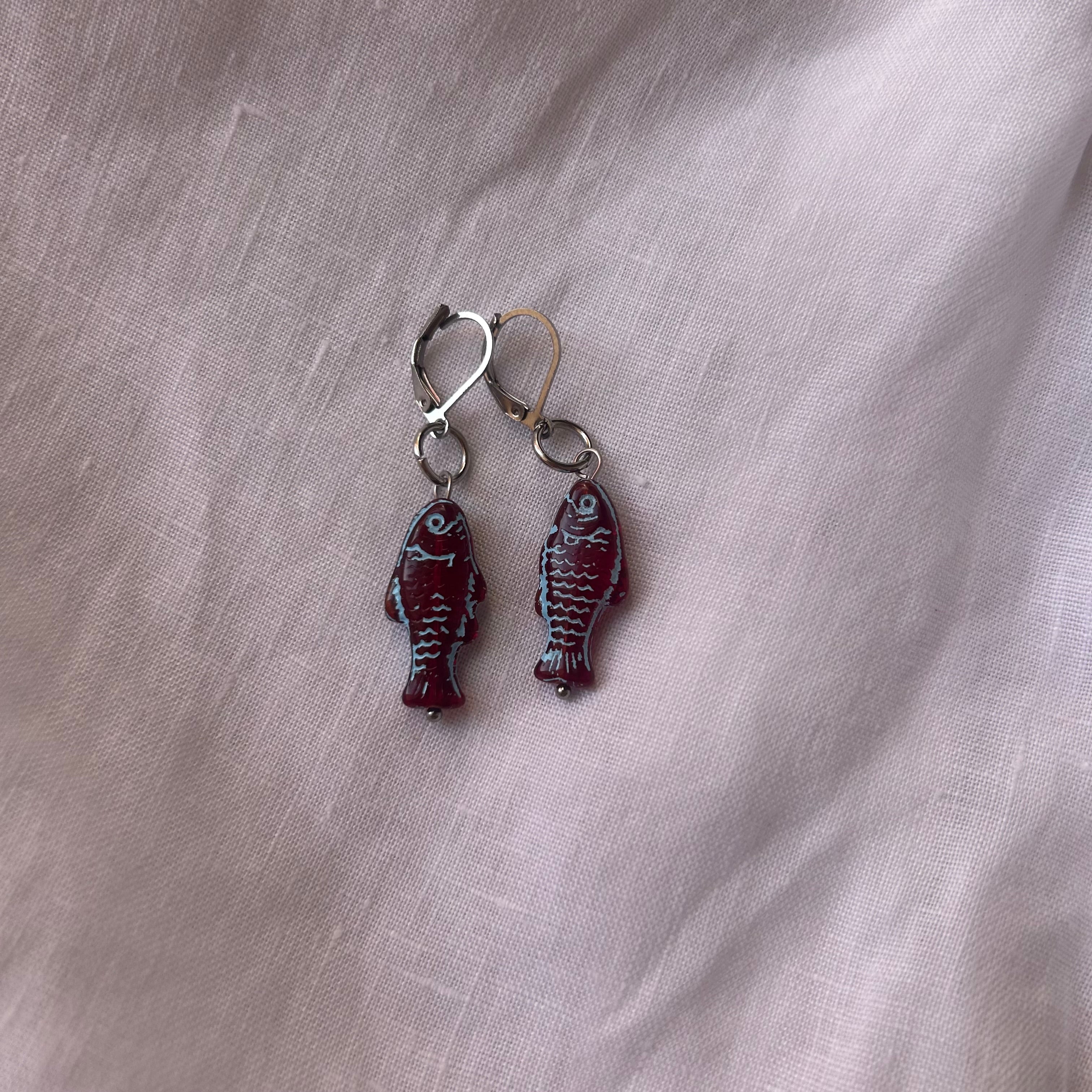 Blue on burgundy fish earrings