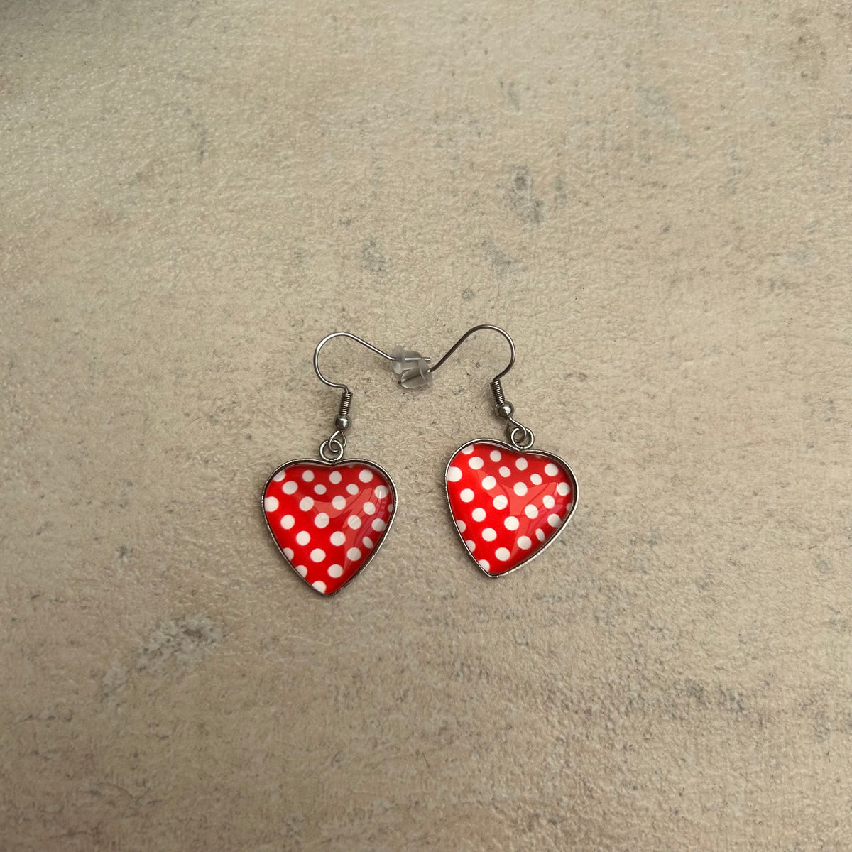 Red and white polka dot resin heart earrings