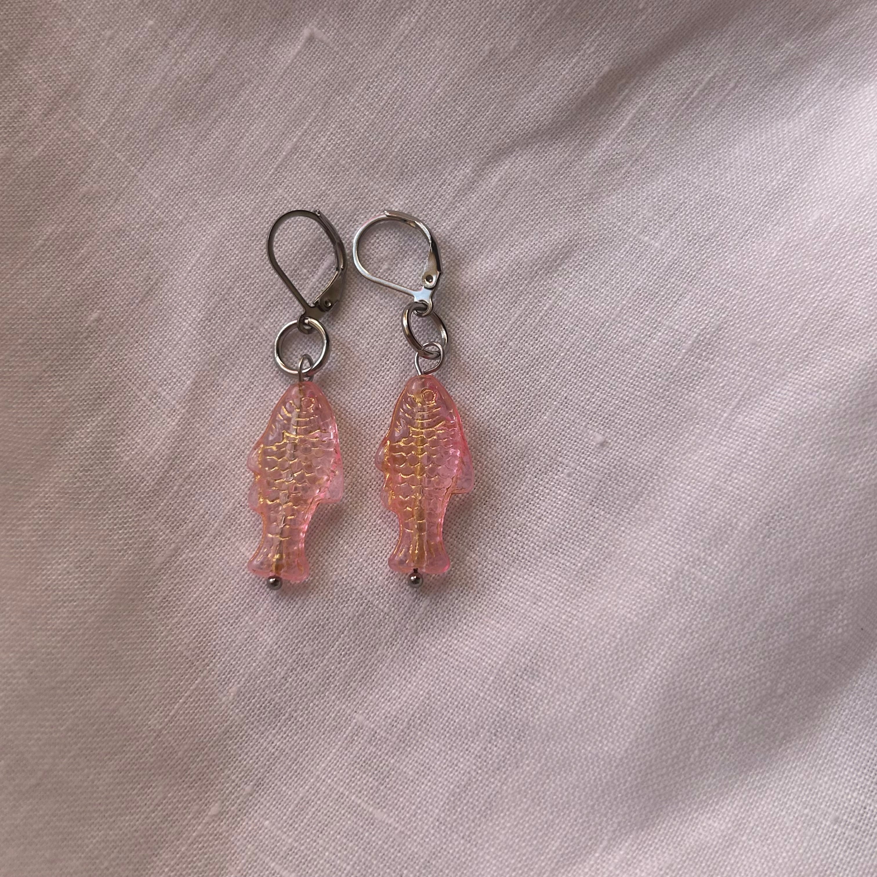 Gold on jelly pink fish earrings